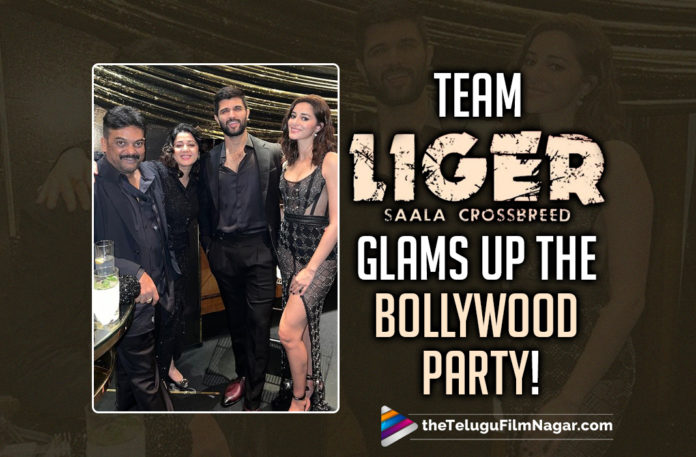 Watch Video: Team Liger Glams Up The Bollywood Party!,Telugu Filmnagar,Latest Telugu Movies 2022,Telugu Film News 2022,Tollywood Movie Updates,Latest Tollywood Updates, Liger,Liger Movie,Liger Telugu Movie,Liger Movie Updates,Liger Movie latest Updates,Liger Vijay Deverakond,Bollywood bash hosted by Dharma Productions’ CEO Apoorva Mehta, Team Liger Rowdy Star Vijay Deverakonda,Ananya Pandey,Charmme Kaur,Puri Jagannadh joined by Katrina Kaif,Vicky Kaushal,Alia Bhatt,Ananya Pandey with Vijay Deverakonda, Ananya Pandey in Liger Movie,Vijay Deverakonda New Movie,Vijay Deverakonda Movies,Vijay Deverakonda Latest News,Liger Update,Liger Release Date,Liger Movie Release Date,Mike Tyson, Vijay Deverakonda Liger Movie Shooting Update,Vijay Deverakonda Liger Update,Puri Jagannadh,Puri Jagannadh Liger,Liger Glimpse,Liger Movie Glimpse,Team Liger Glams Up Video,Watch Video Team Liger Glimpse, Puri Jagannadh Reunite With Vijay Deverakonda For Jana Gana Mana,#Liger,Liger producer Charmmee shared a cute video of the Liger lead pair and more pics of the team on social media, Charmme wrote, “My stunning #liger couple I love u both,Apoorva’s bash in Mumbai Vijay appeared in a trimmed hairstyle,Ananya wore a sheer dress,Ananya and Vijay chatting at the party, Liger is produced by Karan Johar under the banner of Dharma Productions,Puri Jagannadh and Charmee Kaur are also the part of the production as the co-producers, Boxing champion Mike Tyson has a cameo appearance in Liger,Liger film was announced to be released on 25th August 2022,#VijayDeverakonda,#JGM